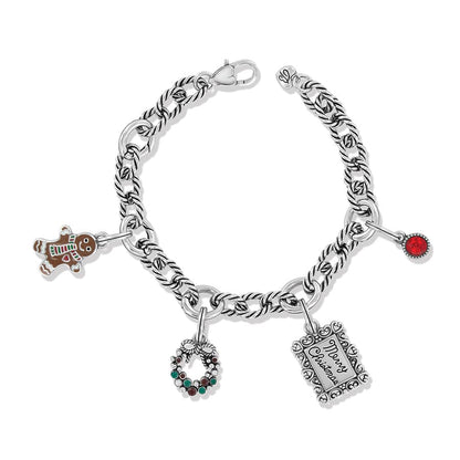 Brighton charm bracelet with gingerbread man, wreath, Merry Christmas frame, and red crystal charms on a white background