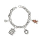 Brighton charm bracelet with silver-tone twisted chain, gingerbread man, Merry Christmas frame, and crystal wreath charms on a white background
