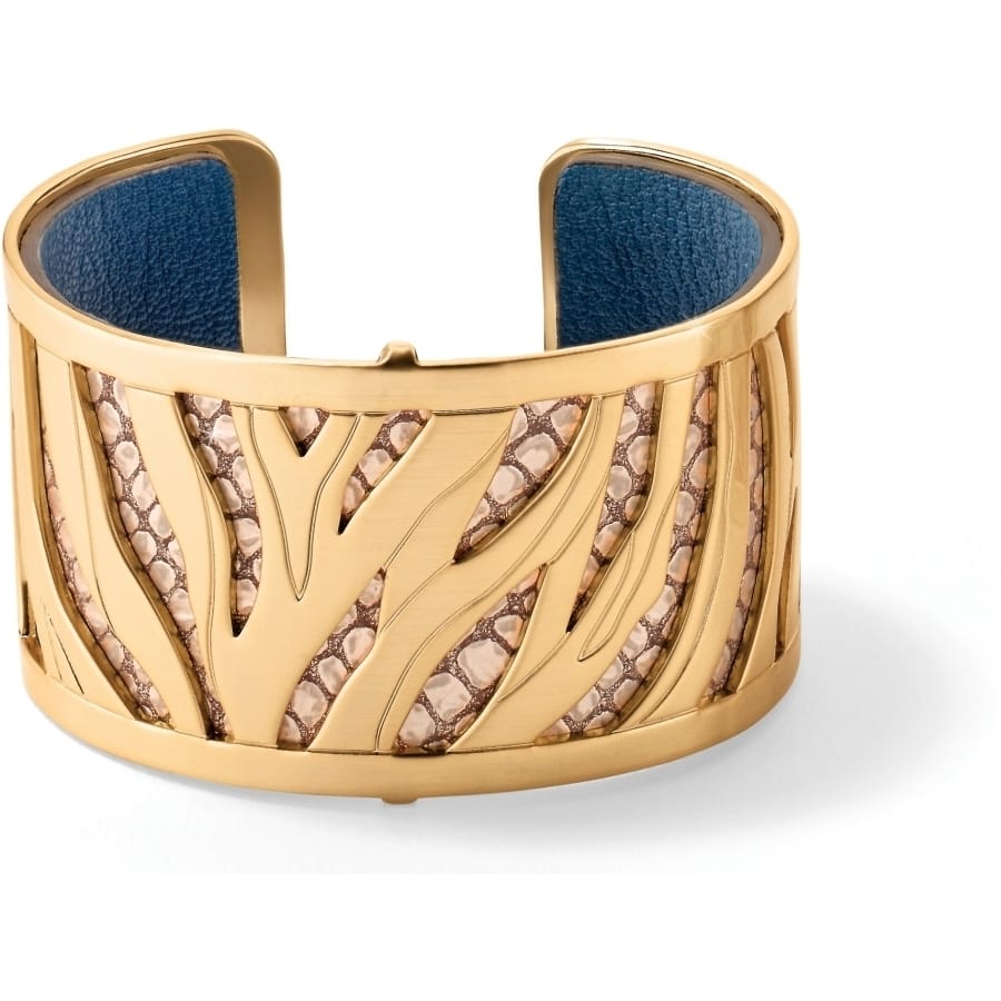 Brighton cuff bracelet with gold-plated zebra-inspired cutouts, snakeskin texture inlay, and blue leather interior on a white background