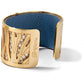 Brighton cuff bracelet with gold-plated finish, cutout design, and blue leather interior lining on a white background