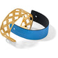 Brighton bracelet set with gold-plated openwork cuff and blue leather band with black interior on a white background