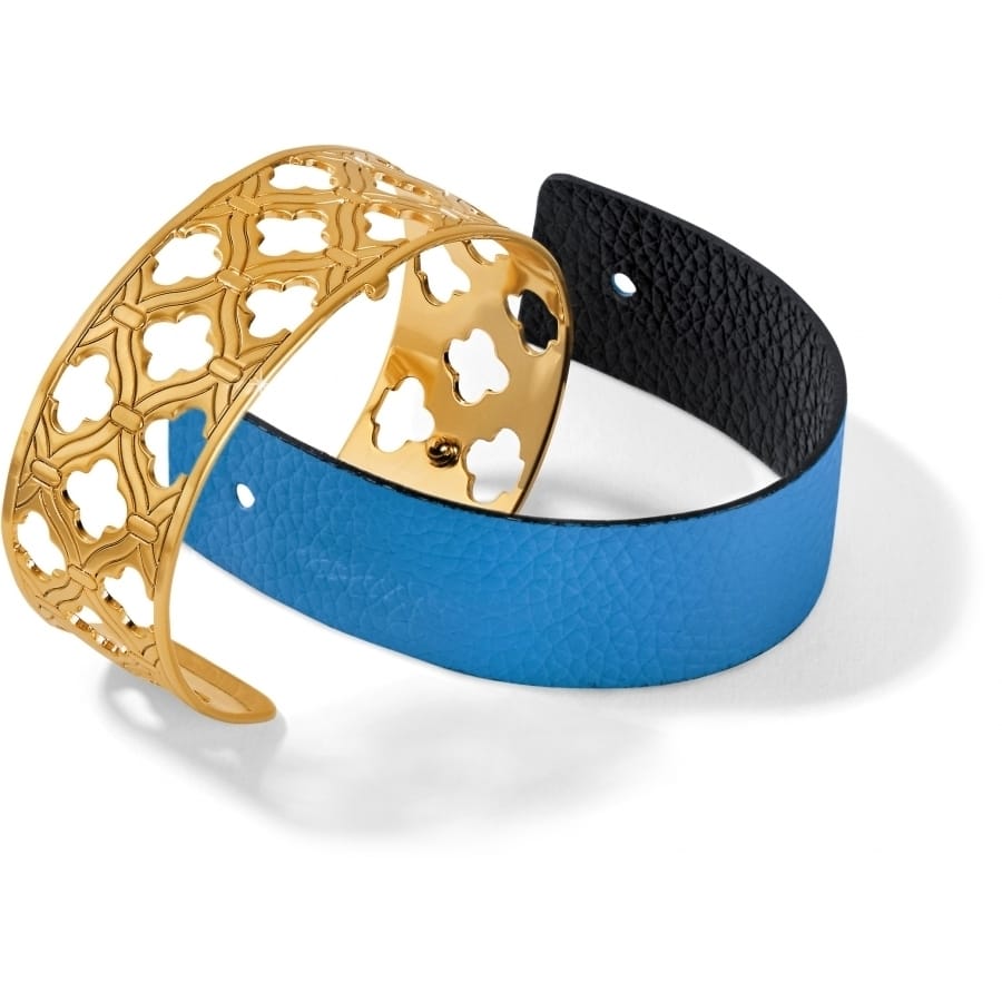 Brighton bracelet set with gold-plated openwork cuff and blue leather band with black interior on a white background