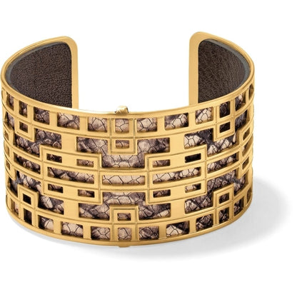 Brighton cuff bracelet with gold-plated geometric openwork design over textured brown and cream leather on a white background