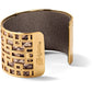Brighton gold-plated cuff bracelet with geometric cutout design over snakeskin print interior on a white background