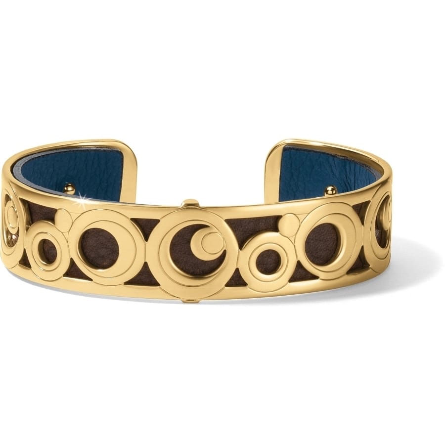 Brighton cuff bracelet with gold-plated circular openwork design over brown leather and blue interior on a white background
