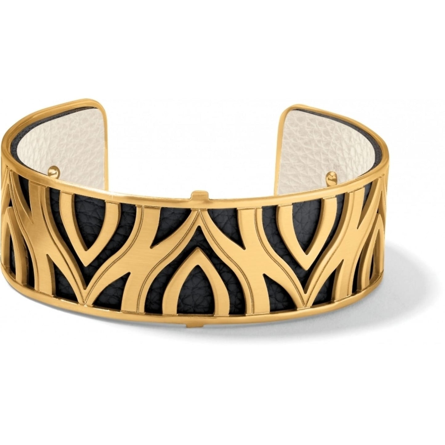 Brighton cuff bracelet with gold-plated cutout design over black leather and cream interior lining on a white background