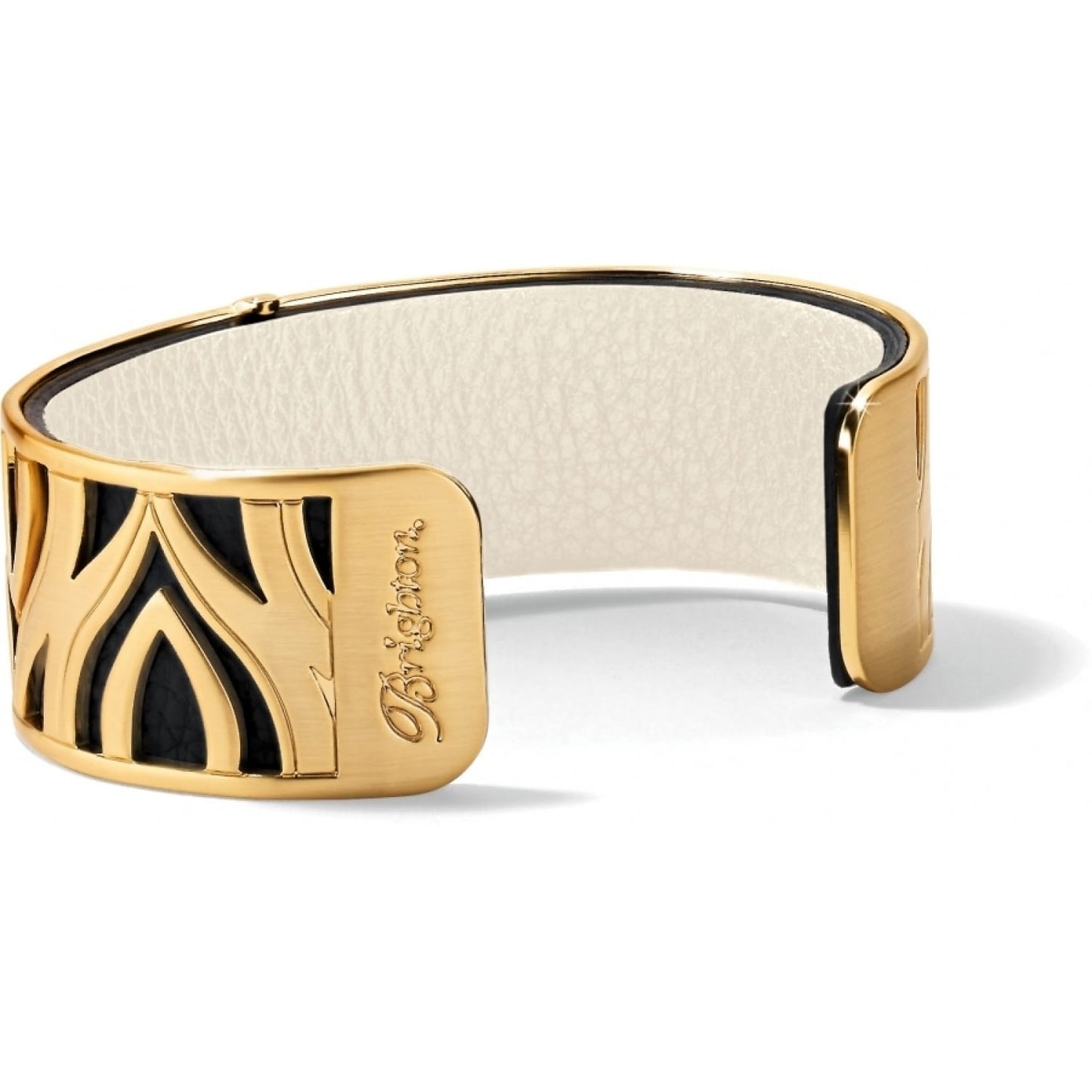 Brighton cuff bracelet with gold-plated cutout design over black leather and cream interior on a white background