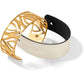 Brighton bracelet set with gold-plated cutout cuff and white leather strap with black accent on a white background