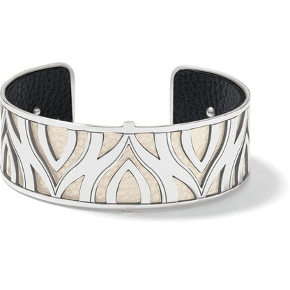 Brighton cuff bracelet with silver-plated cutout petal design over cream and black leather interior on a white background