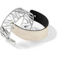 Brighton cuff bracelet with silver-plated cutout design and reversible black and cream leather band on a white background