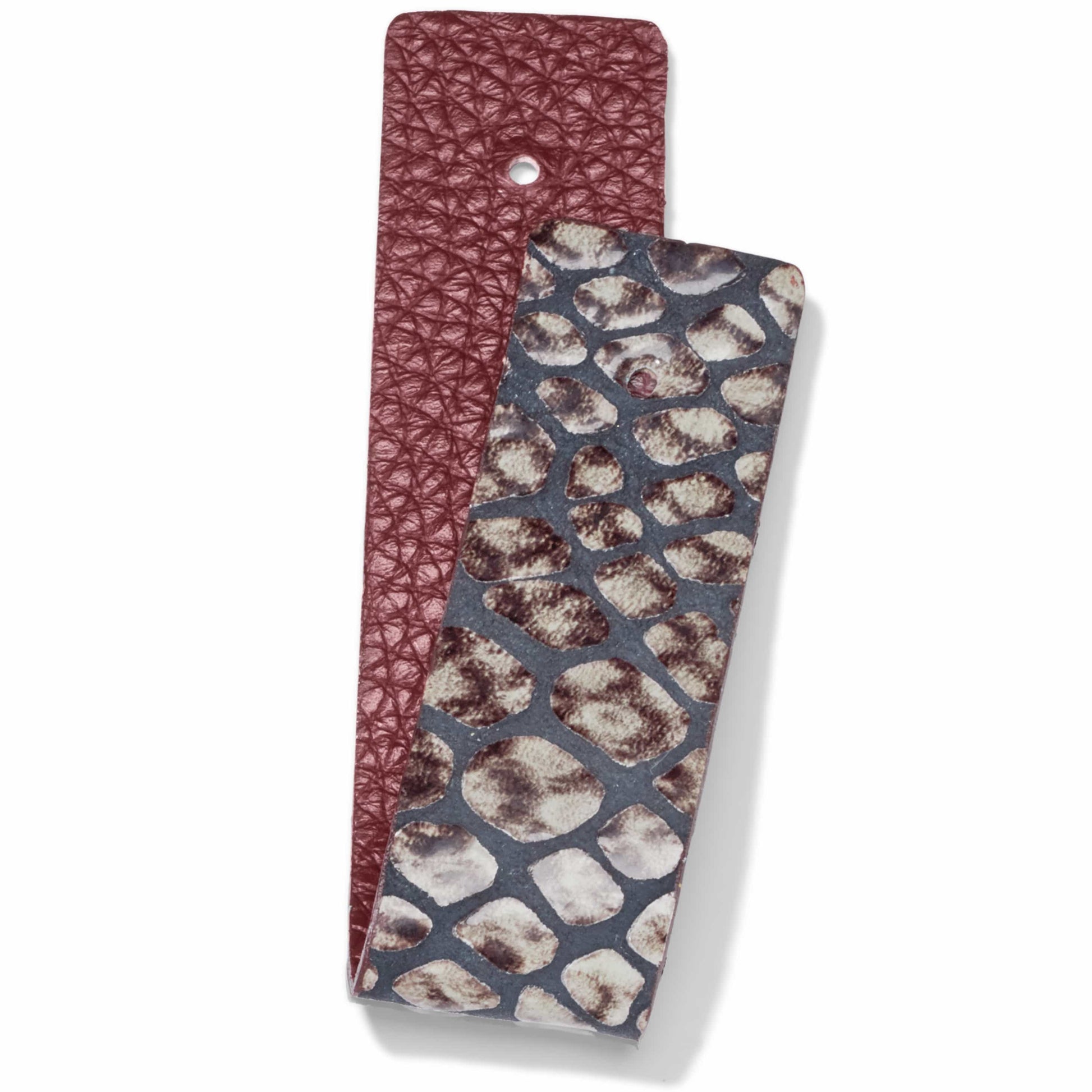 Brighton reversible leather strap with burgundy pebbled side and snake print side on a white background