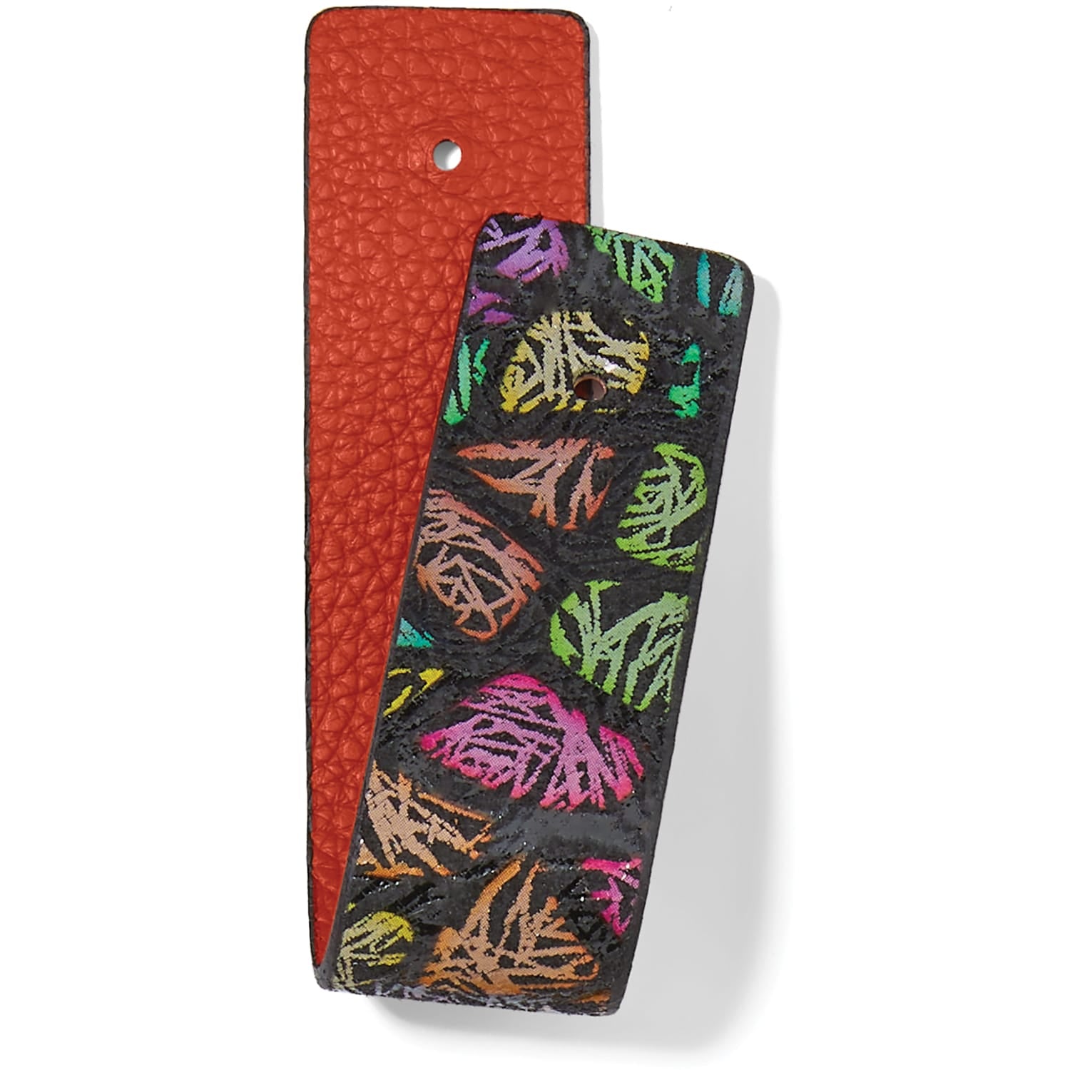 Brighton reversible leather strap with orange pebbled side and black side featuring colorful abstract print on a white background