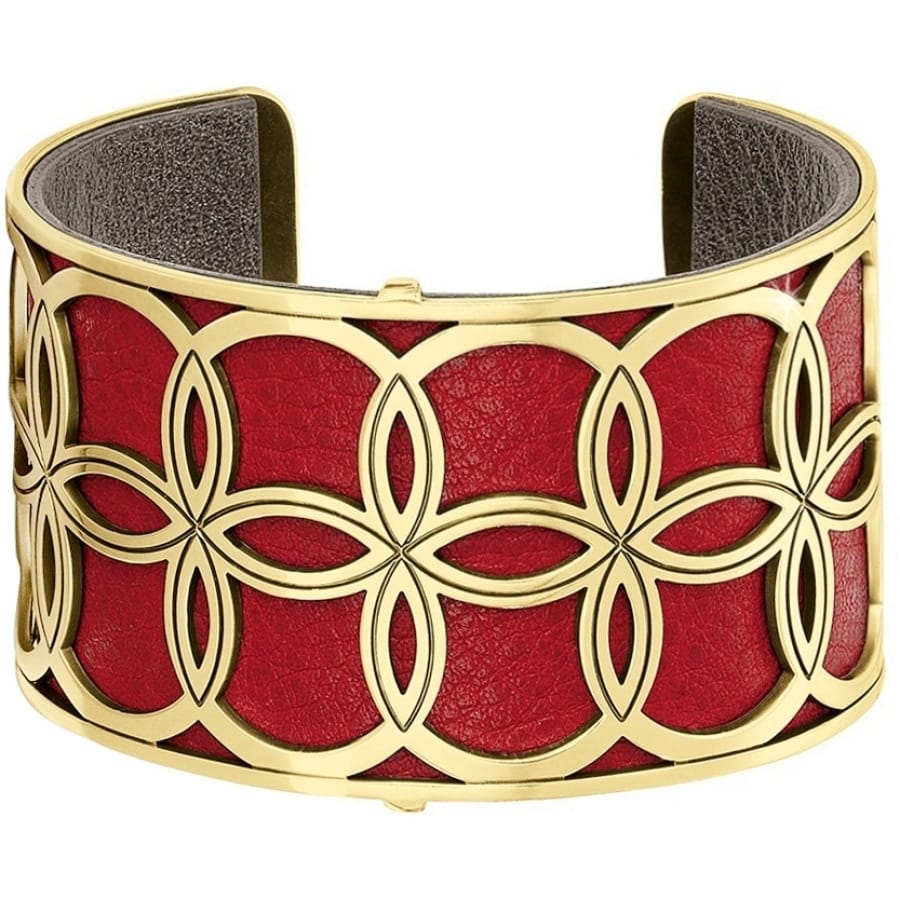 Brighton gold-plated cuff bracelet with red leather interior and floral geometric openwork design on a white background