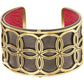 Brighton cuff bracelet with gold-plated floral cutout design over gunmetal base and red leather interior on a white background