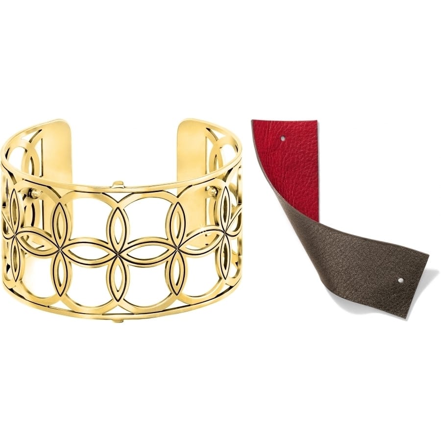 Brighton gold-plated cuff bracelet with floral cutout design shown with reversible red and bronze leather inserts on a white background