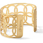 Brighton cuff bracelet with gold-plated floral cutout pattern and engraved logo plate on a white background