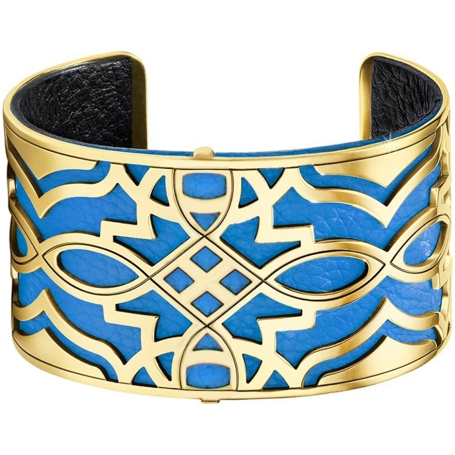 Brighton cuff bracelet with gold-plated geometric openwork design over blue leather backing on a white background