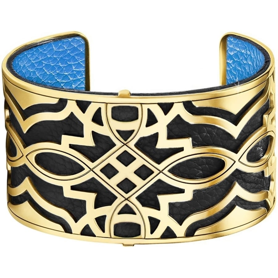 Brighton cuff bracelet with gold-plated geometric openwork design over black and blue leather on a white background