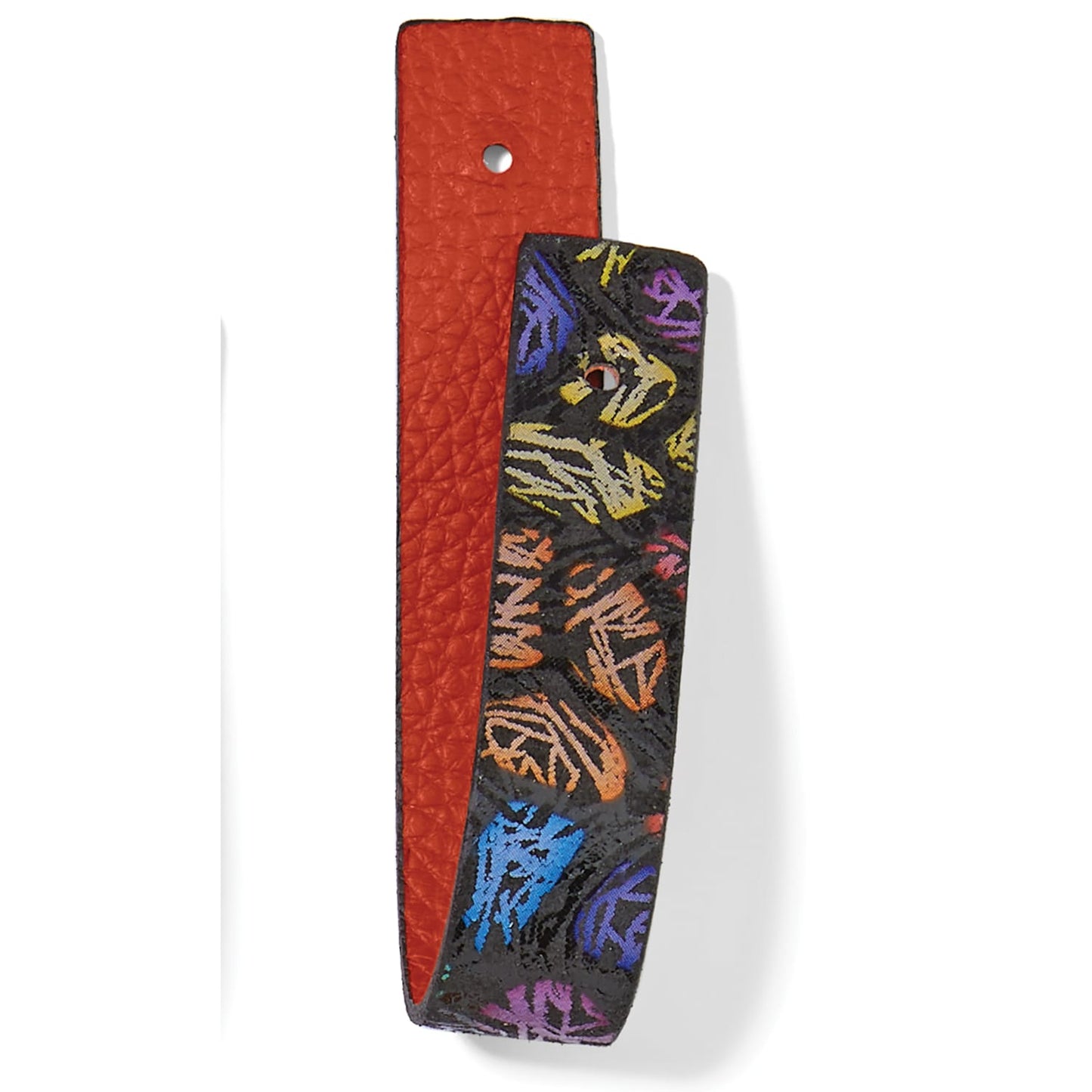 Brighton reversible leather belt strap with orange pebbled side and black multicolor graphic print side on a white background