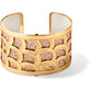Brighton gold-plated cuff bracelet with scalloped cutout design over textured leather insert on a white background