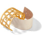 Brighton cuff bracelet with gold-plated scalloped openwork design and cream leather insert on a white background