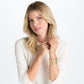 Model wearing a Brighton gold-plated cuff bracelet with leather insert and scalloped openwork design