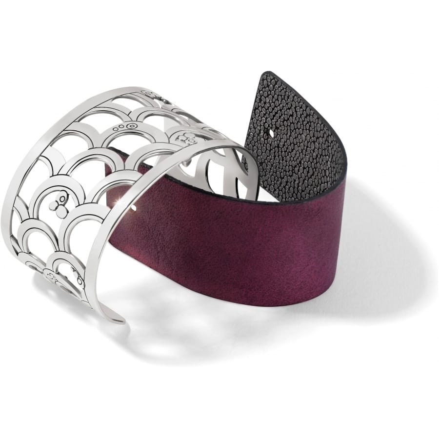 Brighton silver-plated cuff bracelet with scalloped cutout design and purple leather insert on a white background