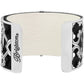 Brighton cuff bracelet with white leather center panel and silver-plated scroll cutout side details on a white background