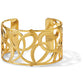 Brighton gold-plated cuff bracelet with wide openwork design featuring interlocking swirl and loop patterns on a white background