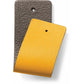 Brighton leather swatch samples in dark brown and yellow with pebbled texture and punched holes on a white background