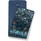 Brighton leather swatches in navy pebbled texture and iridescent green mosaic finish with holographic accents on a white background