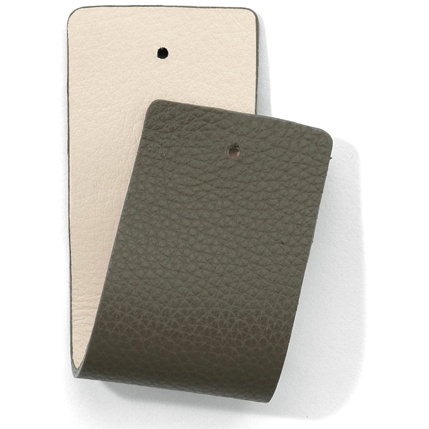 Brighton leather swatches in cream and olive green with small punched holes on a white background