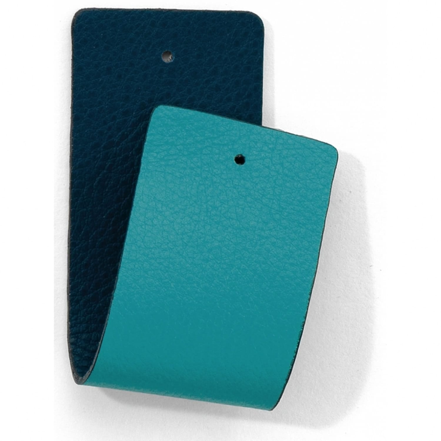 Brighton leather swatches in navy and turquoise with pebbled texture and small punched holes on a white background