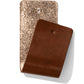 Brighton leather swatches in metallic rose gold glitter and smooth brown finishes on a white background