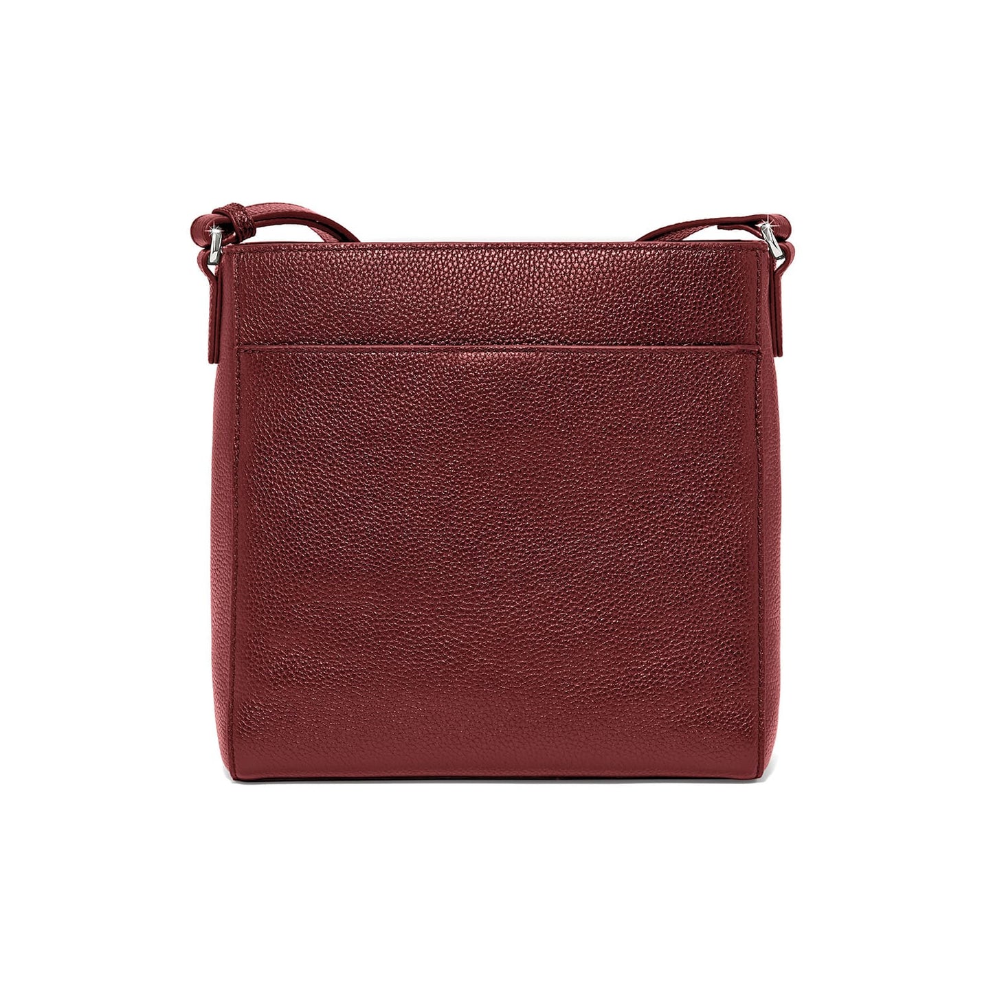 Brighton crossbody handbag in burgundy pebbled leather shown from the back with adjustable strap on a white background