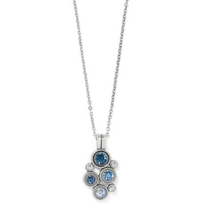 Brighton pendant necklace with blue and clear crystals in silver-plated bezel cluster setting on a white background