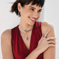 Model wearing a Brighton silver-plated crystal necklace with red and clear stones and coordinating Brighton accessories