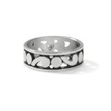 Brighton silver-plated band ring with openwork scroll and dot design along the center on a white background