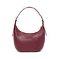 Brighton hobo handbag in burgundy pebbled leather shown from the back with slim top handle on a white background
