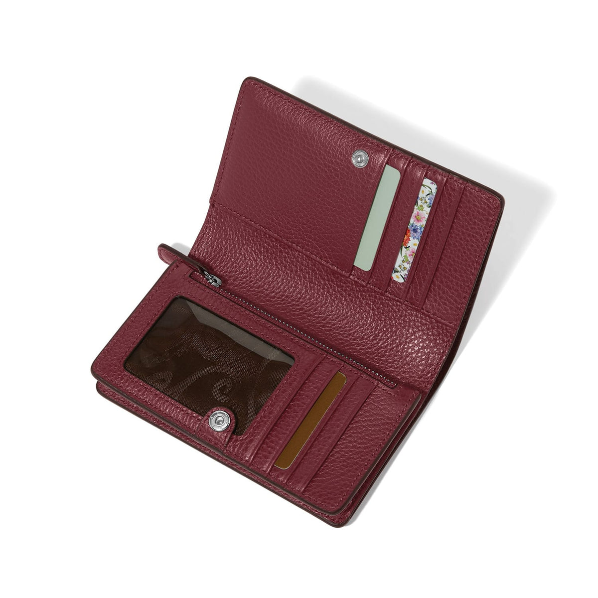 Brighton burgundy leather wallet shown open with card slots, ID window, and zippered coin pocket on a white background
