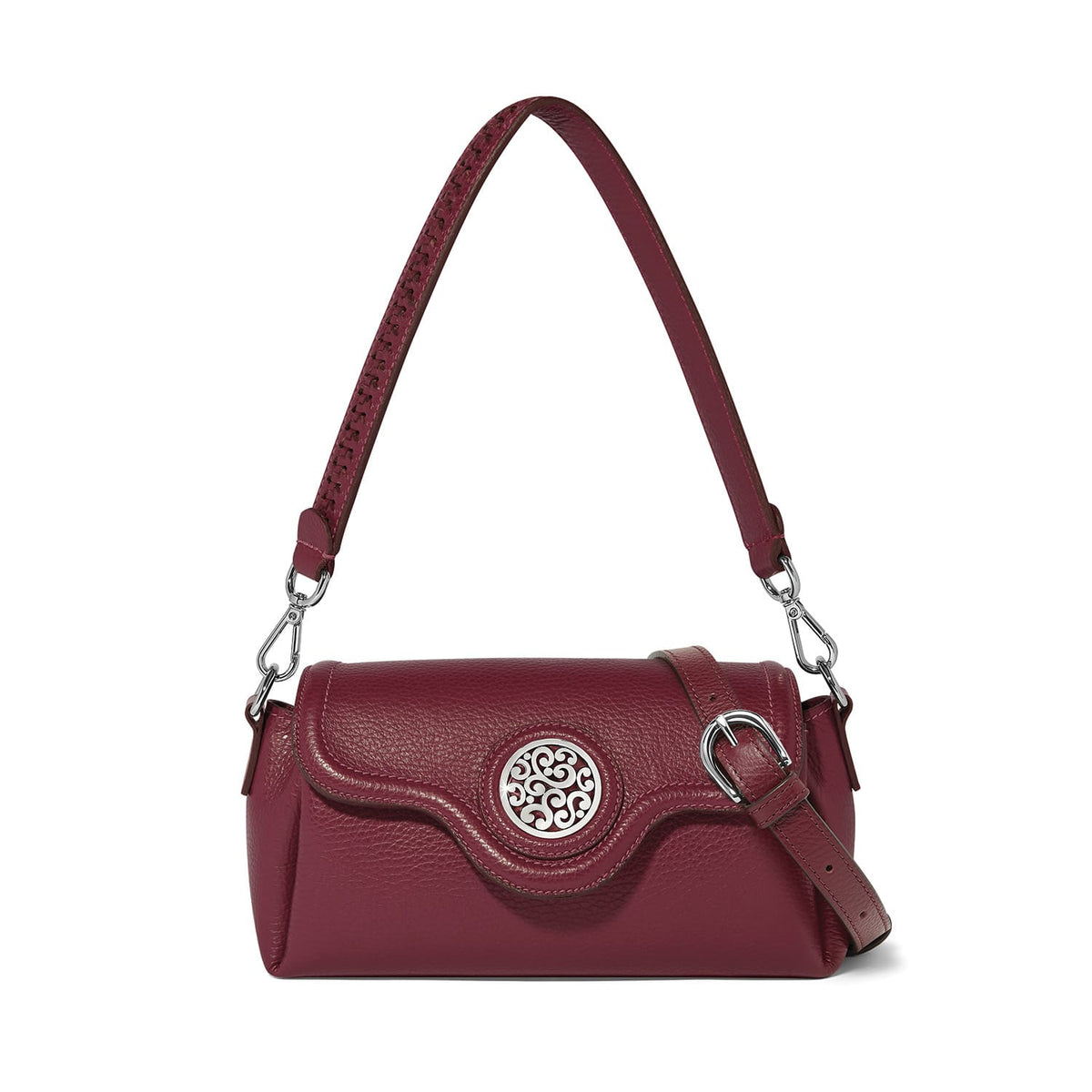 Brighton burgundy leather shoulder handbag with silver-tone medallion, buckle strap, and pebbled texture on a white background