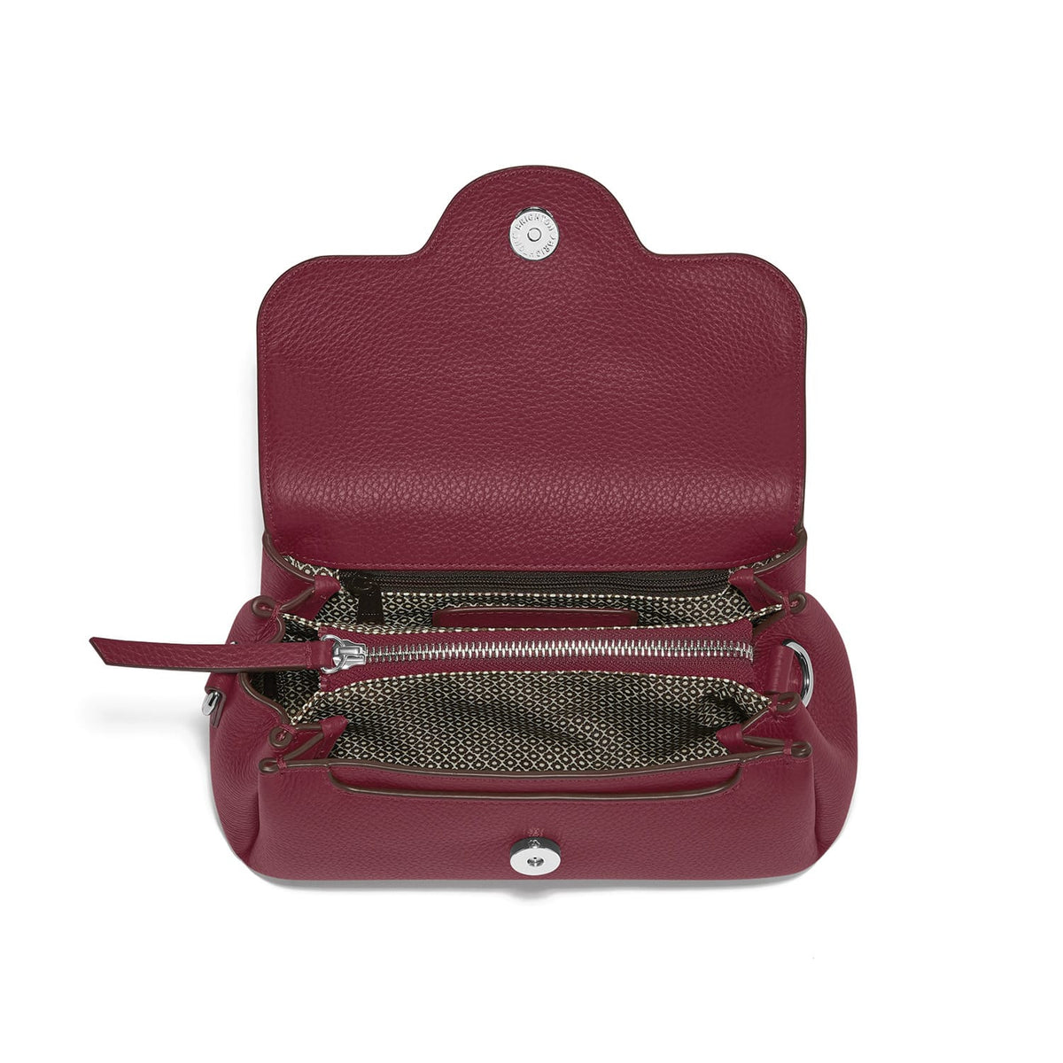 Brighton burgundy leather handbag shown open with patterned fabric interior, zip pocket, and silver-tone snap closure on a white background