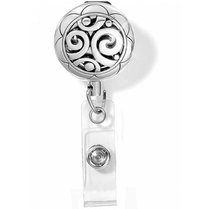 Brighton retractable badge reel with silver-plated round medallion featuring swirl scrollwork design and clip strap on a white background