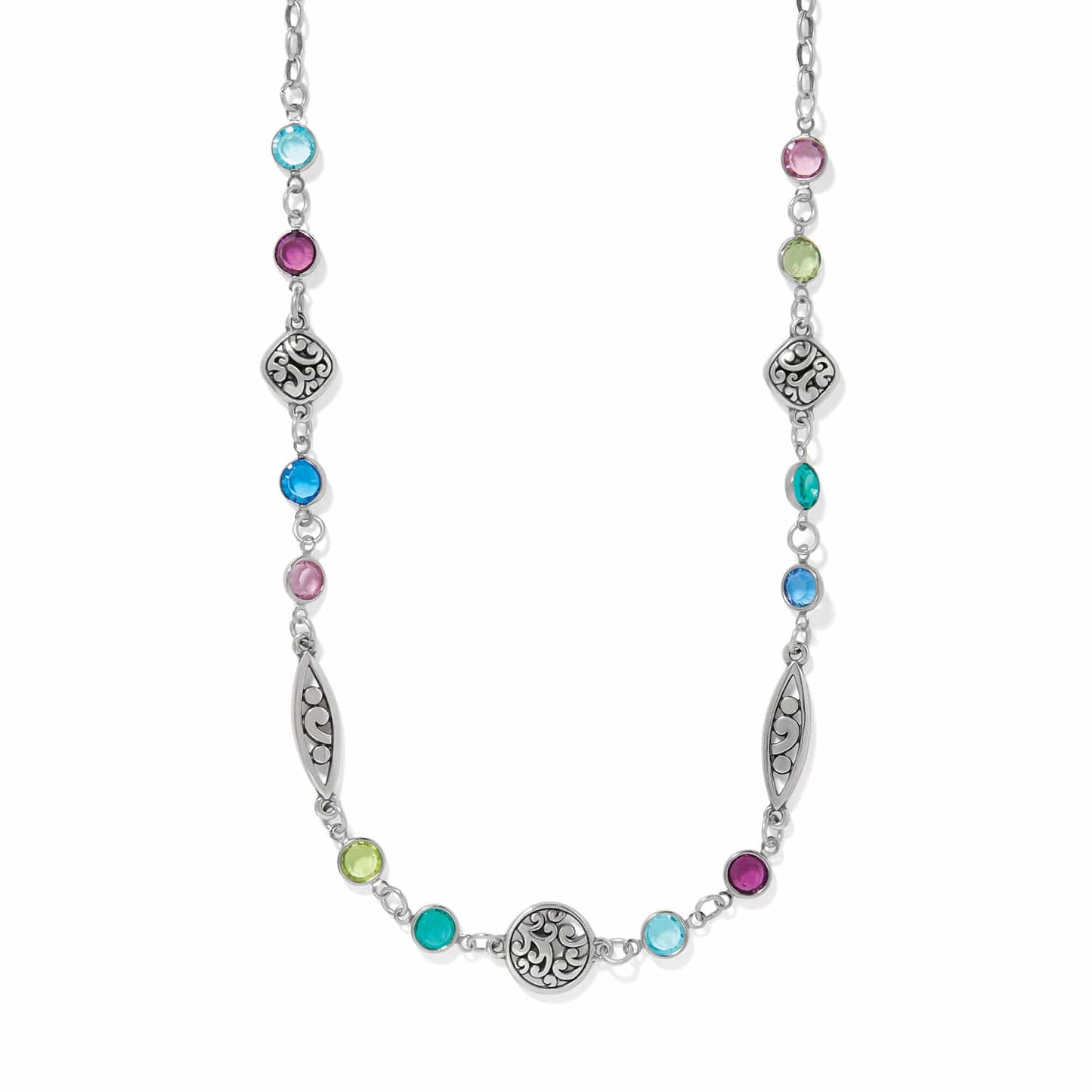 Brighton silver-plated necklace with multicolored crystals and ornate scrollwork medallions on a white background
