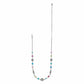 Brighton silver-plated necklace with multicolored crystal stations and ornate scroll medallions on a white background