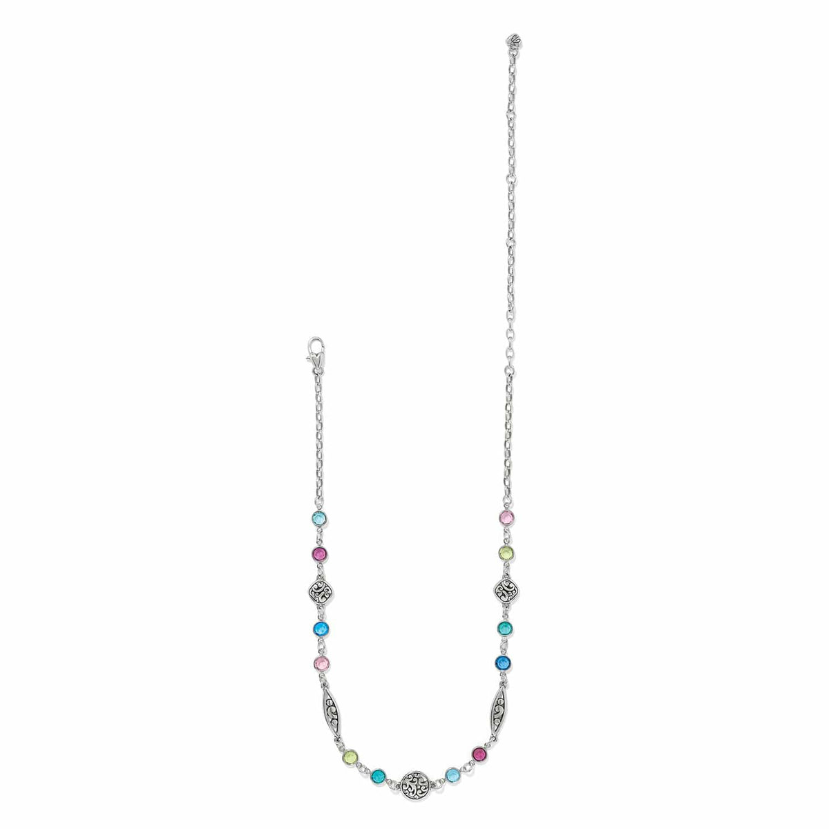 Brighton silver-plated necklace with multicolored crystal stations and ornate scroll medallions on a white background