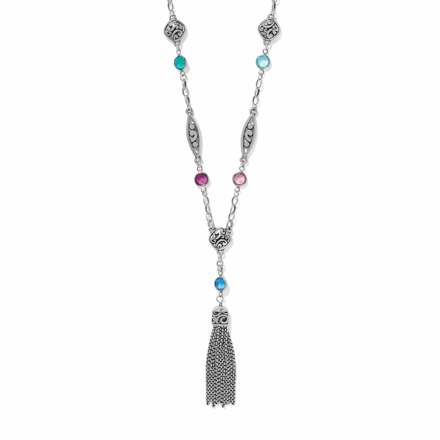 Brighton tassel necklace with silver-plated scrollwork stations, multicolor crystal accents, and chain tassel drop on a white background