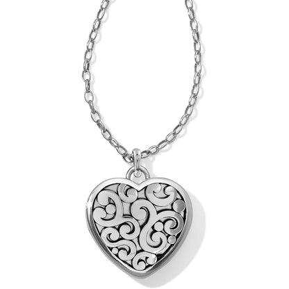 Brighton heart pendant necklace with silver-plated scroll and dot relief design on a white background