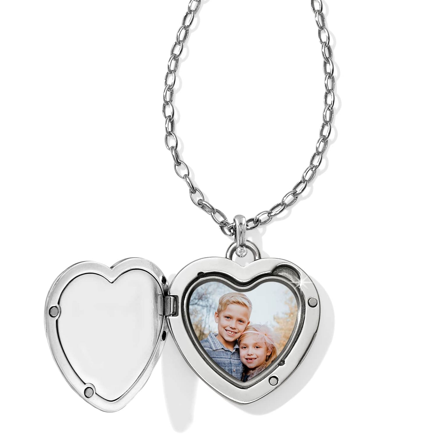 Brighton heart locket necklace shown open with silver-plated chain and photo of two children inside on a white background