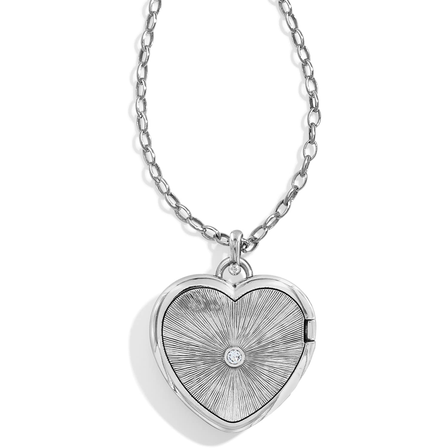 Brighton heart locket necklace with silver-plated sunburst engraved pendant, crystal center, and chain on a white background